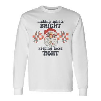 Making Spirits Bright Keeping Faces Tight Santa Christmas Long Sleeve T-Shirt | Mazezy