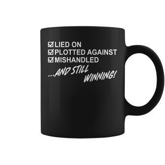 Lied On Plotted Against Mishandled And Still Winning Coffee Mug - Monsterry