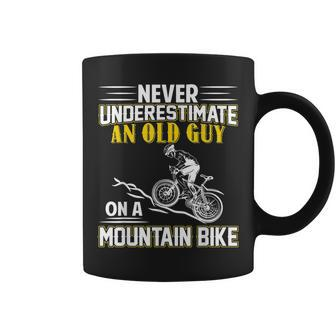 Never Underestimate An Old Guy On A Mountain Bike Gift For Mens Coffee Mug - Seseable