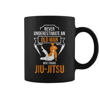 Never Underestimate An Old Man Who Trains Jiujitsu Gift For Mens Coffee Mug - Seseable