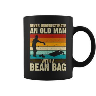 Never Underestimate An Old Man With A Bean Bag Cornhole Coffee Mug - Seseable