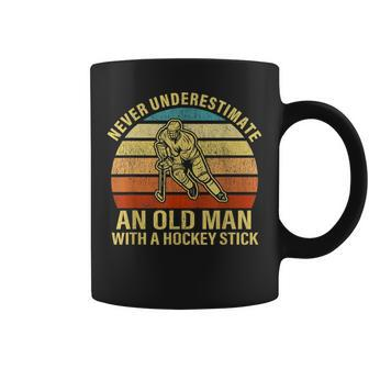Never Underestimate An Old Man With A Hockey Stick Gift Old Man Funny Gifts Coffee Mug | Mazezy