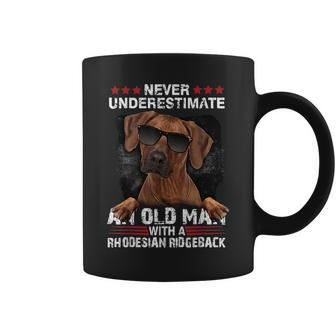 Never Underestimate An Old Man With A Rhodesian Ridgeback Old Man Funny Gifts Coffee Mug | Mazezy