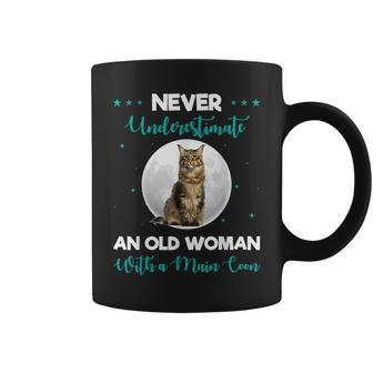 Never Underestimate An Old Woman Maine Coon Funny Cute Old Woman Funny Gifts Coffee Mug | Mazezy