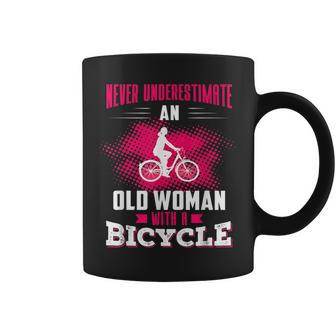 Never Underestimate An Old Woman With A Bicycle Pink Old Woman Funny Gifts Coffee Mug | Mazezy