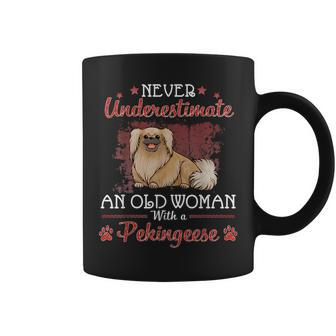 Never Underestimate An Old Woman With A Pekingese Dog Mother Old Woman Funny Gifts Coffee Mug | Mazezy