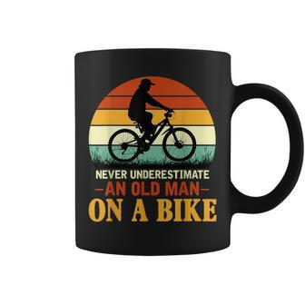 Never Underestimate Funny Quote An Old Man On A Bicycle Retr Coffee Mug - Seseable