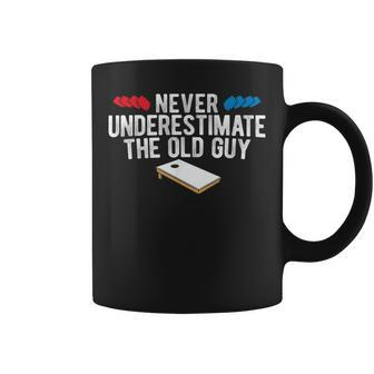 Never Underestimate The Old Guy Cornhole Gift For Mens Coffee Mug | Mazezy