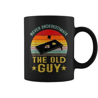 Never Underestimate The Old Guy Funny Cornhole Game Player Coffee Mug | Mazezy