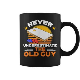 Never Underestimate The Old Guy I Funny Cornhole Gift For Mens Coffee Mug | Mazezy