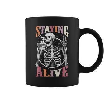 Staying Alive Skeleton Drinking Coffee Lover Halloween Coffee Mug - Monsterry
