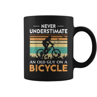 Never Underestimate An Old Guy On A Bicycle Cycling Vintage Coffee Mug - Seseable