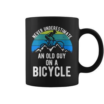 Never Underestimate An Old Guy On A Bike Mountain Mens Coffee Mug - Seseable