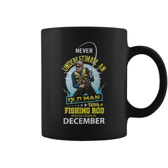 Never Underestimate Old Man With A Fishing Rod Born In Dec Coffee Mug - Seseable