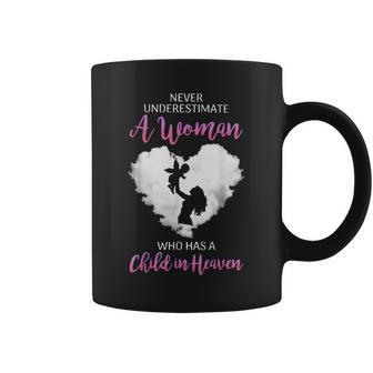 Never Underestimate A Woman Who Has A Child In Heaven Coffee Mug | Mazezy