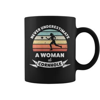Never Underestimate A Woman At Cornhole Coffee Mug | Mazezy