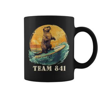 Vintage Surfing Otter 841 California Sea Otter Team 841 Coffee Mug - Monsterry