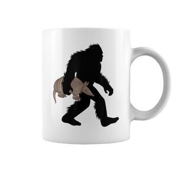 Bigfoot Cradling Armadillo Cryptid Sasquatch Coffee Mug | Mazezy