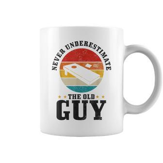 Cornhole Never Underestimate The Old Guy Funny Vintage Gift For Mens Coffee Mug | Mazezy