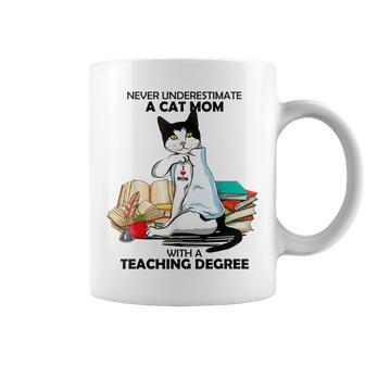 Never Underestimate A Cat Mom With A Teaching Degree Gift Coffee Mug - Seseable