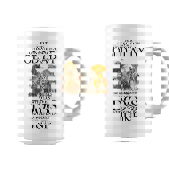 Never Underestimate An Old Lady Who Loves Dogs Born June Coffee Mug - Seseable