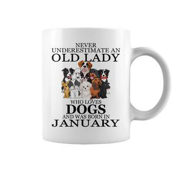 Never Underestimate An Old Lady Who Loves Dogs January Coffee Mug - Seseable