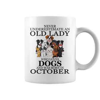 Never Underestimate An Old Lady Who Loves Dogs October Coffee Mug - Seseable