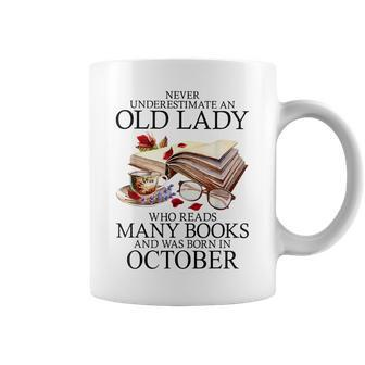 Never Underestimate An Old Lady Who Reads Many Books October Coffee Mug | Mazezy
