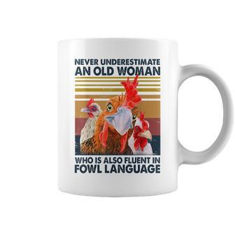 Never Underestimate An Old Woman Fluent In Fowl Language Coffee Mug - Seseable