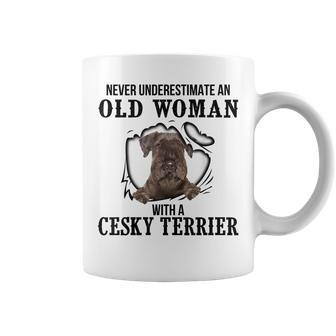 Never Underestimate An Old Woman With A Cesky Terrier Old Woman Funny Gifts Coffee Mug | Mazezy