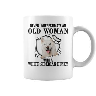 Never Underestimate An Old Woman With A White Siberian Husky Old Woman Funny Gifts Coffee Mug | Mazezy