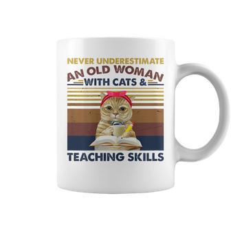 Never Underestimate An Old Woman With Cats & Teaching Skills Gift For Womens Coffee Mug - Seseable