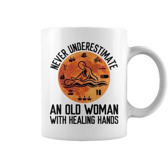 Never Underestimate An Old Woman With Healing Hands Old Woman Funny Gifts Coffee Mug | Mazezy