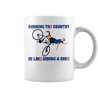 Running The Country Is Like Riding A Bike Funny Biden Running Funny Gifts Coffee Mug | Mazezy