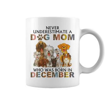 Never Underestimate A Dog Mom Who Was Born In December Coffee Mug - Seseable