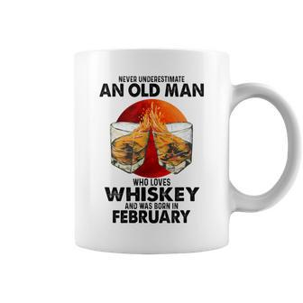 Never Underestimate An Old February Man Who Loves Whiskey Coffee Mug - Seseable