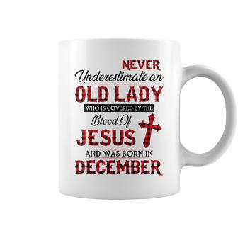 Never Underestimate An Old Lady Who Is Covered By-December Coffee Mug | Mazezy