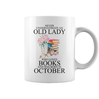 Never Underestimate An Old Lady Who Loves Books Born October Coffee Mug | Mazezy