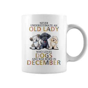Never Underestimate Old Lady Loves Dogs Born In December Coffee Mug - Seseable