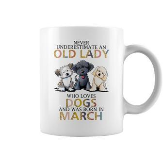 Never Underestimate Old Lady Loves Dogs Born In March Coffee Mug - Seseable