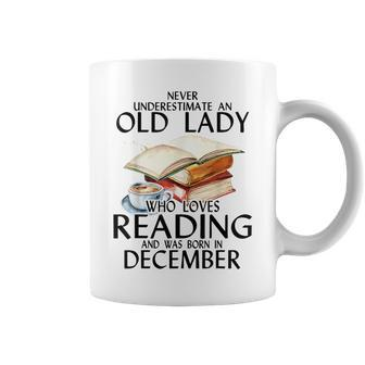 Never Underestimate An Old Lady Who Loves Reading December Coffee Mug | Mazezy
