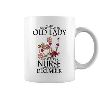 Never Underestimate An Old Lady Who Is Also A Nurse December Coffee Mug - Seseable