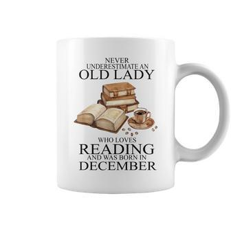 Never Underestimate An Old Lady Reading Born In December Coffee Mug | Mazezy
