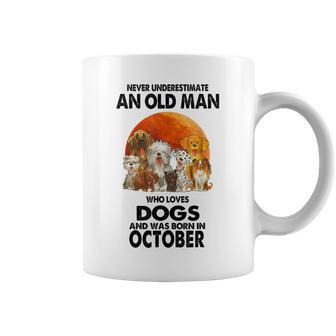 Never Underestimate An Old Man Who Loves Dogs Born October Coffee Mug | Mazezy