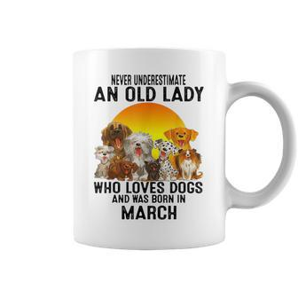 Never Underestimate An Old March Lady Who Loves Dogs Pet Coffee Mug - Seseable