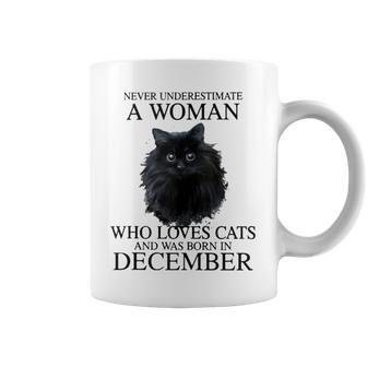 Never Underestimate A Woman Who Loves Cats Born In December Coffee Mug - Seseable