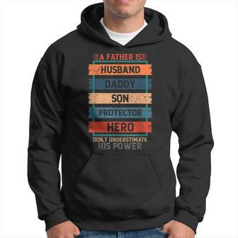 A Father Is Husband Daddy Son Protector Hero Fathers Day Hoodie - Seseable