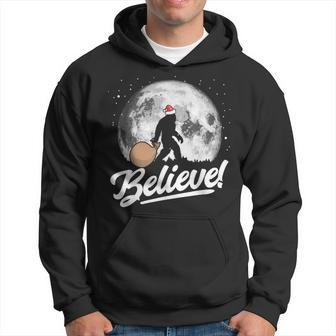 Believe Santa Bigfoot Christmas Snow & Moon Night Graphic Hoodie - Thegiftio UK