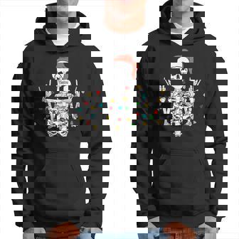 Christmas Skeleton Rocker Wrapped In Xmas Lights Santa Hat Hoodie - Monsterry
