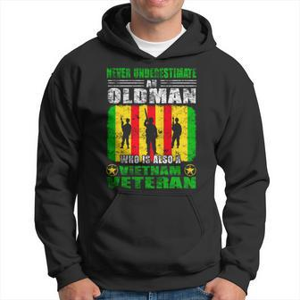 Never Underestimate A Vietnam Veteran Proud Army Gift Veteran Funny Gifts Hoodie | Mazezy